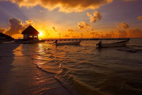Holbox Island pier palapa sunset beach in Mexico Quintana roo