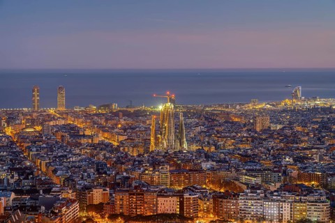 The Barcelona skyline with the famous Sagrada Familia at dusk