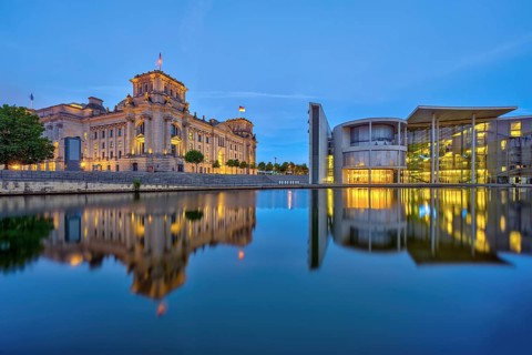 The Reichstag and the Paul Löbe House on the Spree in Berlin at dusk