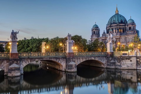 Berlin Cathedral and a bridge over the river at dusk