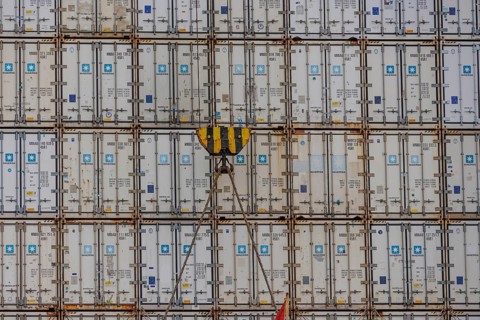 Stack of freight containers in the harbour, arranged in even rows, hook in the middle, Bremerhaven,