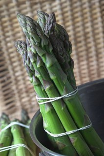 A bunch of green asparagus in a saucepan