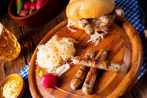 Rustic Thuringian bratwurst with sauerkraut and roll