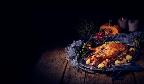 Roast duck with potato dumplings and plums