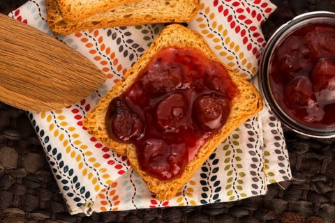 Breakfast of cherry jam on toast
