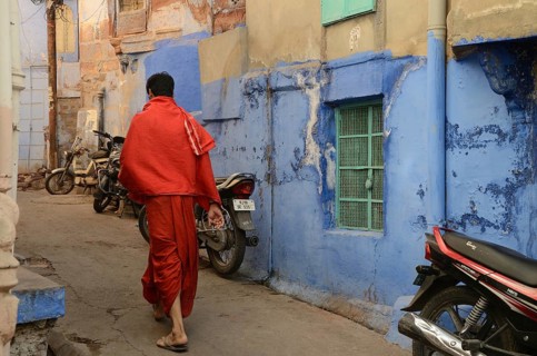 Priest walking in narrow lane, jodhpur, rajasthan, India, Asia, NOMR, Asia