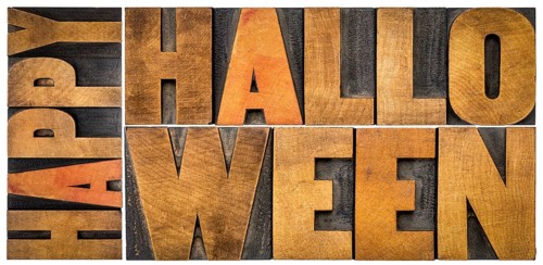 Happy Halloween banner or greeting card - isolated word abstract in vintage grunge letterpress wood