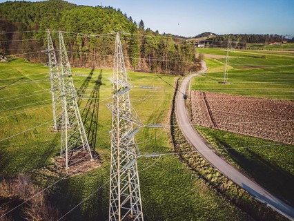 Electrical power substation in the country side of Slovenia. Fields and forests surrounding the