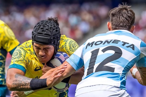 Men?s Pool B Rugby Seven: Team Australia back Dietrich Roache (4) (AUS) fights for the ball during