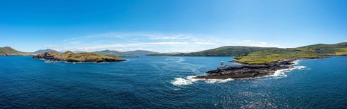 An aerial panorama of the coastal landscape of the Iveragh Peninsula with Beginish and Valentia