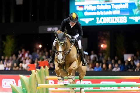 Philipp Schulze Topphoff of Germany competes in the equestrian Audi Grand Prix at Jumping