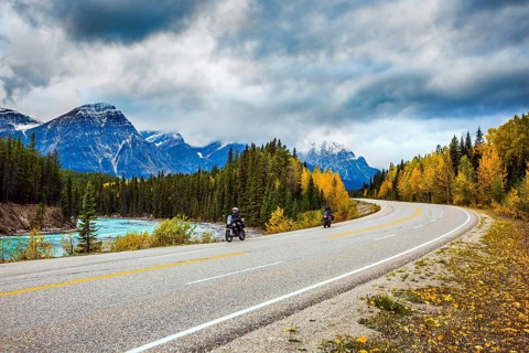 Motorcyclists driving on the road. The concept of active tourism. The astonishing nature of the