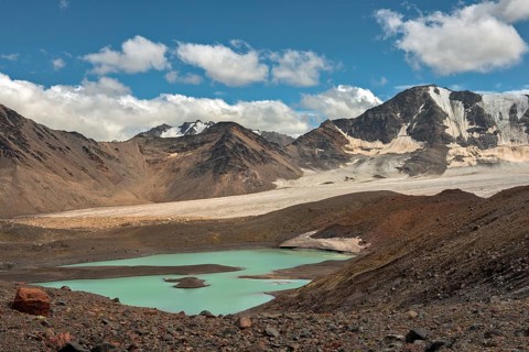 Mountain landscape with glaciers and lake near Elbrus on Caucasus, Russia, Europe