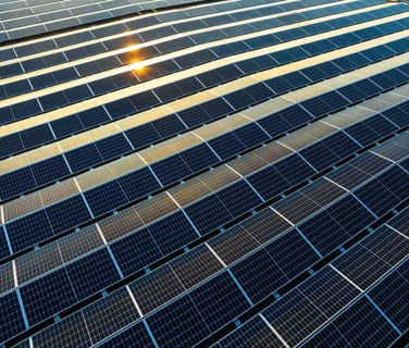 Industrial warehouse with roof loaded with solar panels