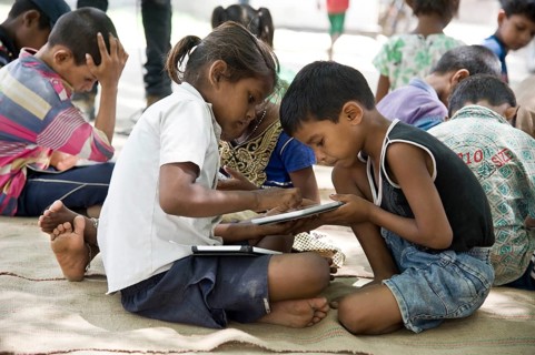 Children studying on tablet, varanasi, uttar pradesh, india, asia