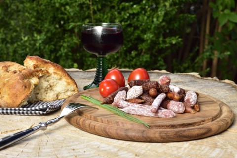 A picnic with salami and red wine