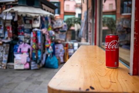 Coca Cola can on a wooden table, Venice, Italy, Europe