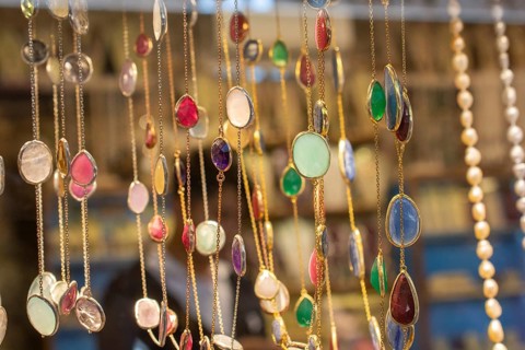 Handcrafted necklace. String of beads in various colors. Colorful beads necklaces