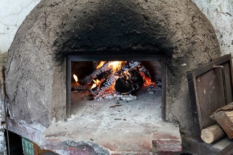 Clay oven with wood burning inside
