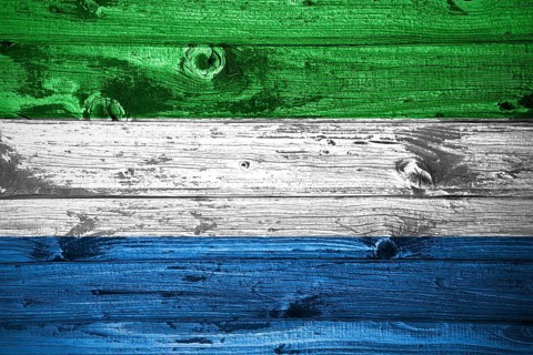 Sierra Leone flag on wooden planks background wood flag
