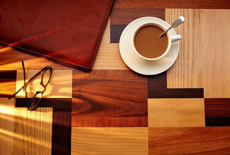 Coffee cup with glasses and leather folder on table retro vintage