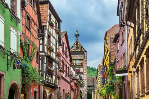 Main street with historical houses in Riquewihr, Alsace, France, Europe