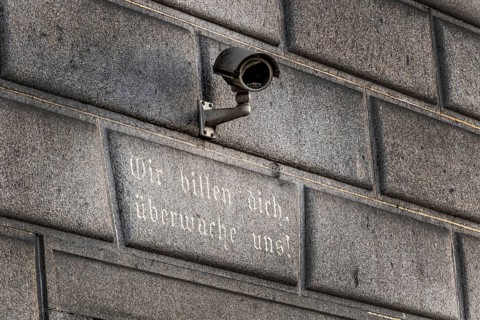 Surveillance camera on a building, symbol for surveillance, internal security, control, data