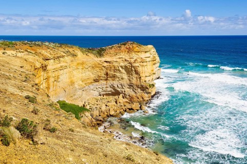 Tourists admire the iconic Twelve Apostles from the Castle Rock lookout, Port Campbell, Victoria,