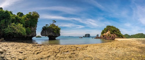 Tropical islands view with ocean blue sea water and white sand beach at Koh Phak Bia, Krabi