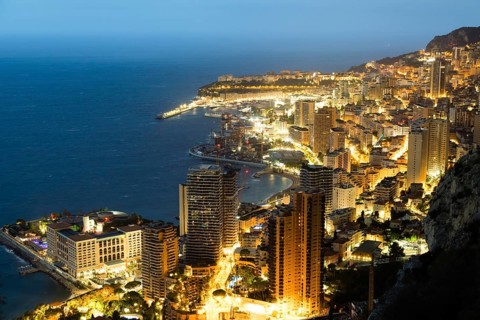 Monte Carlo panorama illuminated by night. Urban landscape with luxury architecture