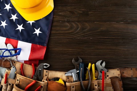 Tools hardhat toolbelt and us flag on wooden background labor day banner mockup