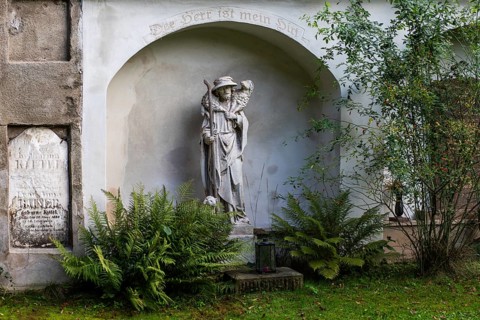 Shepherd carrying a sheep, sculpture in a cemetery, Jakobifriedhof, Leoben, Styria, Austria, Europe