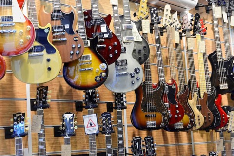A music shop with a variety of hanging electric guitars in different designs, Istanbul, Istanbul