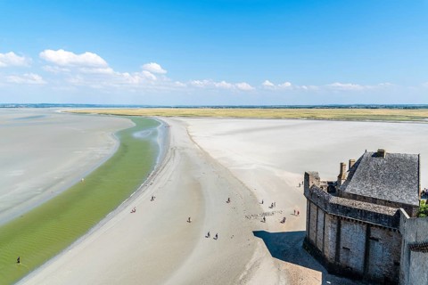 Mont Saint Michel, France, July 25, 2018: View of the bay of Mont Saint Michel from the ramparts at