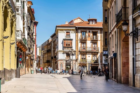 Oviedo, Spain, April 1, 2019: Street with traditional houses in historic city center, Europe