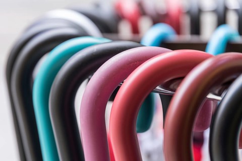 Colourful handles of parasols and umbrellas - close-up