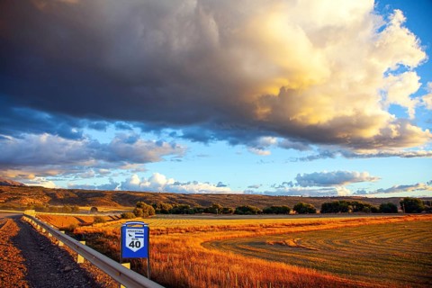 The endless Argentinean prairie and the famous Ruta 40 dirt road. A gigantic scenic thundercloud