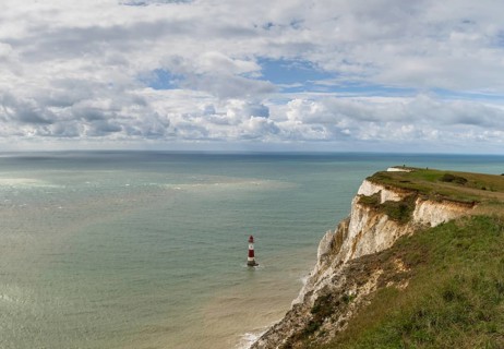 View of the Beachy Head Lighthouse in the English Channel and the white cliffs of the Jurassic