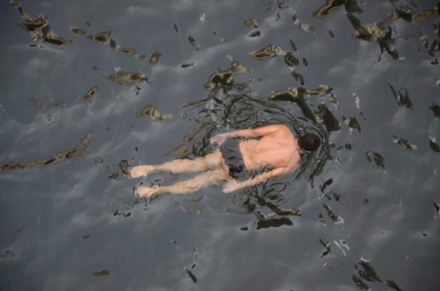Man swimming in stepwell, jodhpur, rajasthan, India, Asia