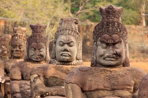 Balustrade with stone gods and demons on the bridge to the southern Tor tor of Angkor Thom