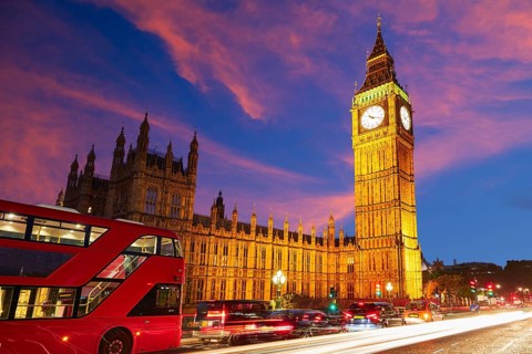 Big Ben Clock Tower with London Bus sunset in England