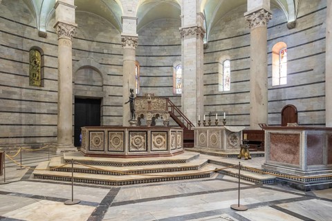 Pisa, Italy, 29 June 2023: Baptistery interior, basilica altar, catholic church. Italy travel
