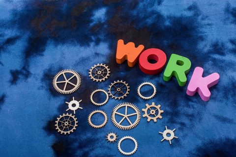 Work wording and wooden cogwheels as industry mechanism concept