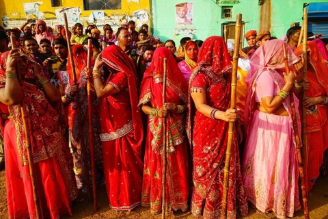 Women with sticks, Lathmar Holi festival, Mathura, Uttar Pradesh, India, Asia