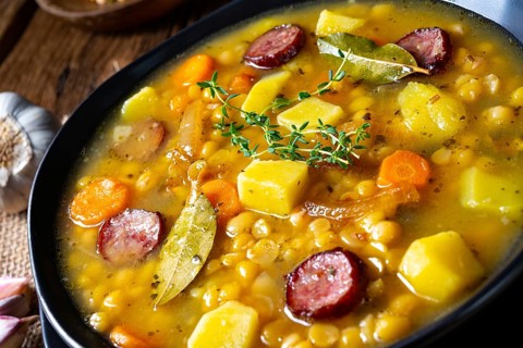 Rustic pea soup with bacon and sausage