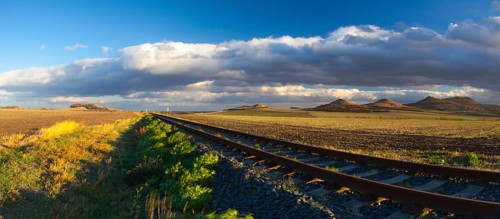 Single railway track at sunset, Central Bohemian Uplands, Czech Republic. Railway track in nature