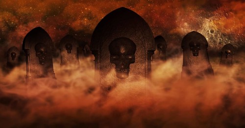 Cemetery At Night With Tombstones With Skulls And Burning Sky Full Of Clouds and Stars in The