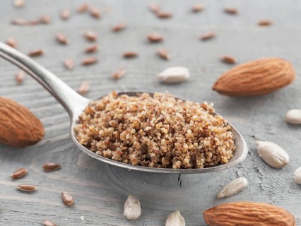 Homemade LSA mix in spoon - Linseed or flax seeds, Sunflower seeds and Almonds. Traditional