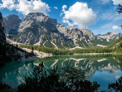 Hiking along the beautiful Braies lake in the Dolomites, South Tyrol