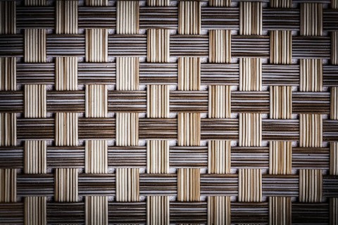 Texture old dusted wicker mat close up